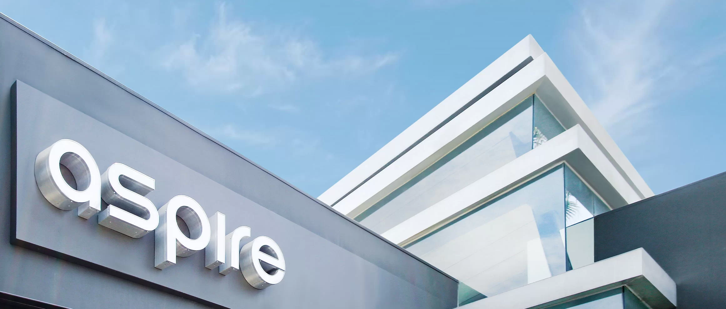 Μια απεικόνιση των εγκαταστάσεων της aspire με το λογότυπο σε πρώτο πλάνο.