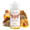 Οπτική απεικόνιση της συσκευασίας του Kings Crest Don Juan Tobacco Honey 120ml που πλαισιώνεται από τριμένα φύλλα καπνού μέλι και κηρήθρα
